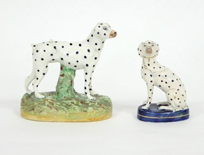 Lot 342 - Two Staffordshire figures of dalmatians, 16cm...