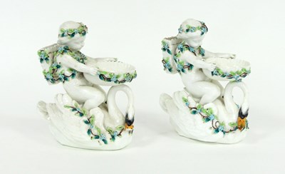 Lot 348 - A pair of Continental porcelain figural vases...