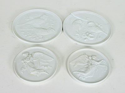 Lot 371 - Two pairs of parian porcelain circular plaques,...