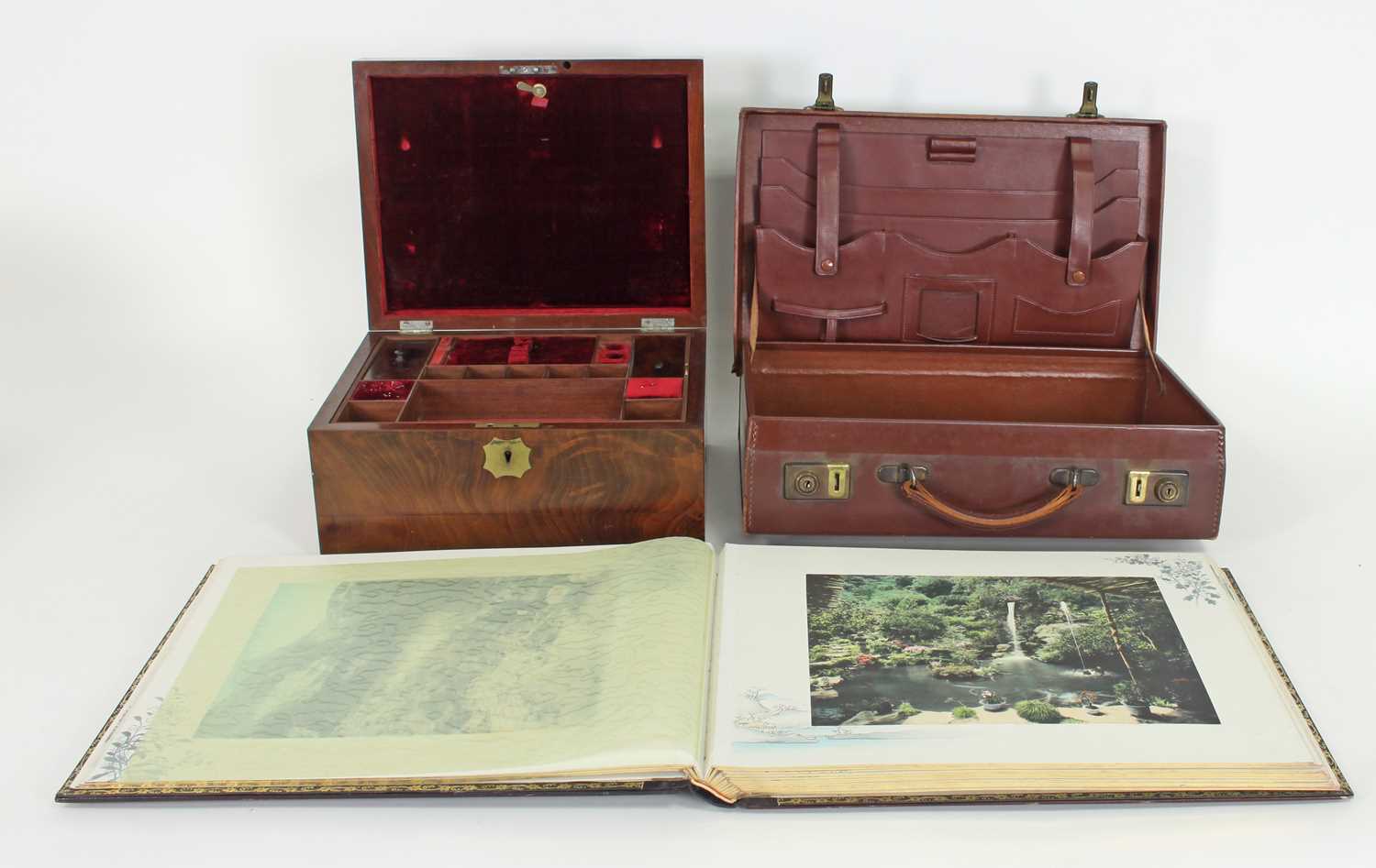 Lot 410 - A Japanese photograph album, the hand tinted...