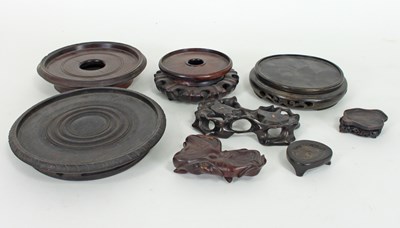 Lot 425 - A collection of Chinese wooden stands