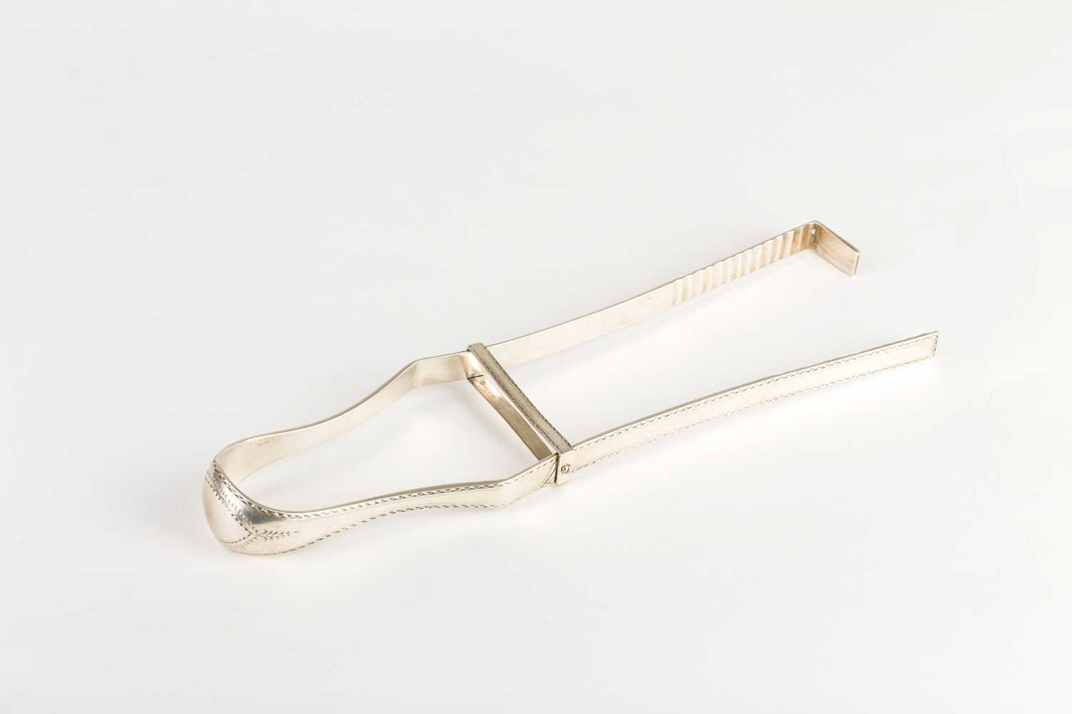 Lot 552 - A pair of Irish silver asparagus tongs,...