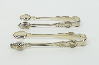 Lot 556 - A pair of Irish Queens pattern silver sugar...