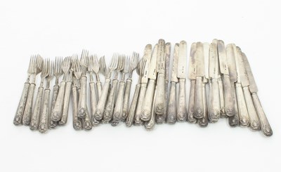 Lot 585 - A set of eighteen silver dessert knives and...