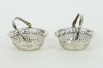 Lot 599 - A pair of silver pierced oval sweetmeat...