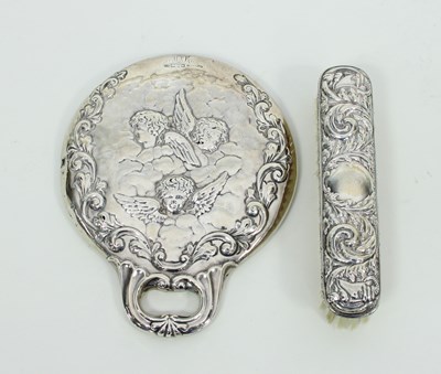 Lot 608 - A silver backed hand mirror, Chester 1902,...