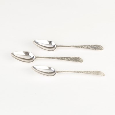 Lot 624 - Three Guernsey bright cut silver teaspoons,...