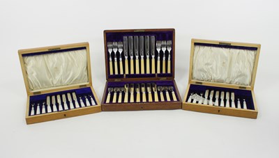 Lot 648 - Two cased sets of six silver dessert knives...