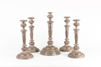 Lot 670 - A set of five plated candlesticks, each with...