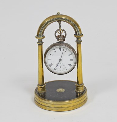 Lot 685 - A silver cased pocket watch mounted on a brass...