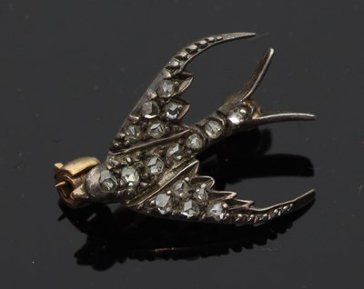 Lot 703 - A small diamond set brooch of swallow form