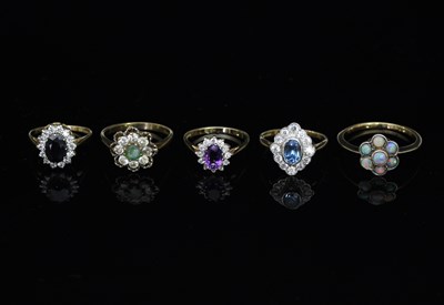 Lot 107 - Five gem set cluster rings, each on a 9ct gold...