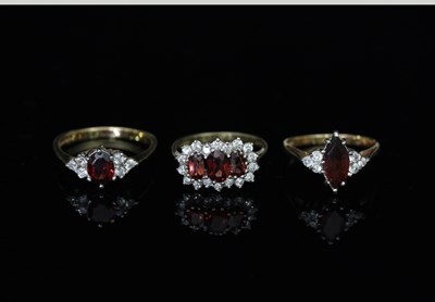 Lot 108 - A three-stone cluster dress ring, on a 9ct...