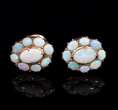 Lot 134 - A pair of opal cluster ear studs, each with...