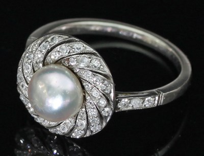 Lot 169 - A natural pearl and diamond ring, the central...