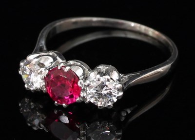 Lot 170 - A ruby and diamond three-stone ring, the...