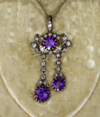 Lot 173 - An amethyst and diamond pendant, the central...