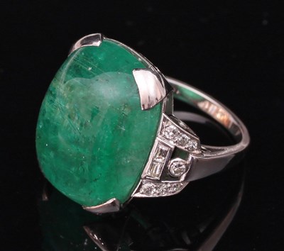 Lot 180 - An Art Deco emerald and diamond cocktail ring,...