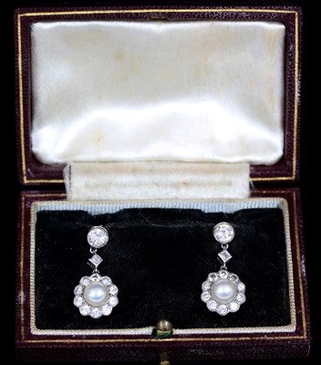 Lot 184 - A pair of pearl and diamond cluster ear...