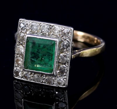 Lot 185 - An emerald and diamond cluster ring, of...