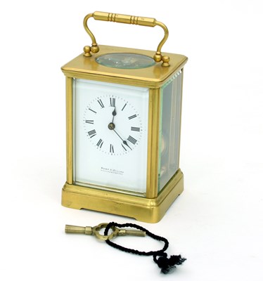 Lot 233 - A carriage clock with alarm, in a gilt brass...