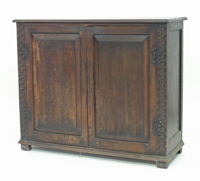 Lot 252 - An oak cupboard enclosed by panelled door,...