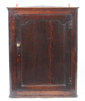 Lot 273 - A mahogany corner cupboard with single panel...