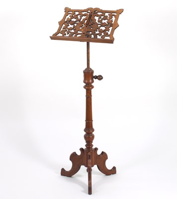 Lot 274 - A Victorian walnut music stand with carved...