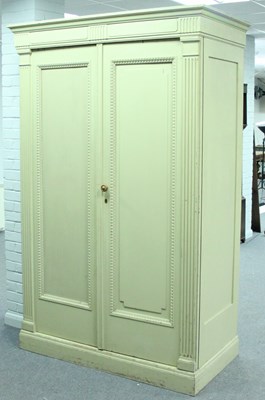 Lot 308 - A painted wardrobe, the moulded cornice above...