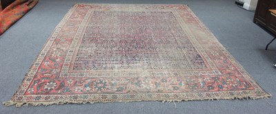 Lot 310 - A Feraghan carpet with all over blue ground...