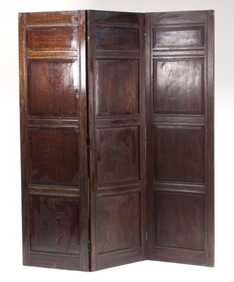 Lot 322 - An oak two-fold screen with fielded panels,...