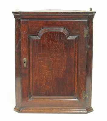 Lot 331 - A 19th Century oak corner cupboard enclosed by...