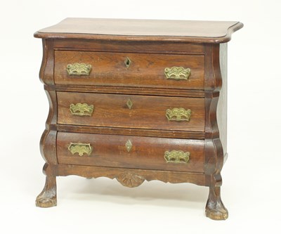 Lot 336 - A Dutch oak chest of three drawers, on ball...