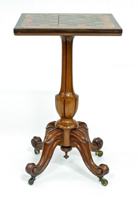 Lot 356 - A Victorian walnut games table, the top inset...