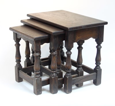 Lot 360 - A nest of three oak tables, each rectangular...