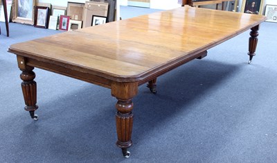 Lot 362 - A Victorian oak dining table, the rounded...