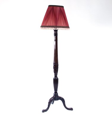 Lot 378 - A mahogany standard lamp, carved with wheat...