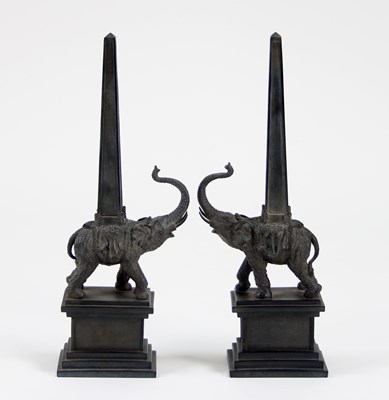 Lot 415 - A pair of composition figural obelisks each...