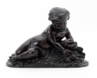 Lot 424 - A 19th Century bronze figure of a putto...