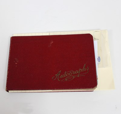 Lot 619 - An autograph book including autographs of...