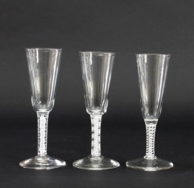 Lot 675 - Three similar 18th Century ale glasses, each...