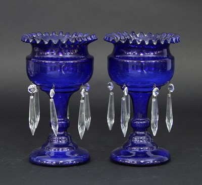 Lot 683 - A pair of blue glass lustres, each with a...