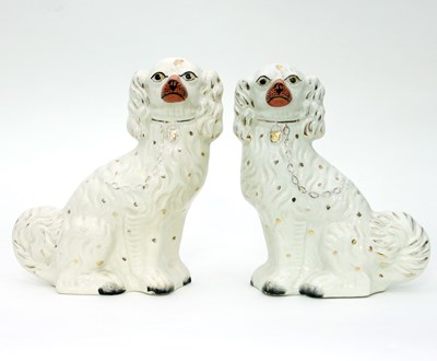 Lot 714 - A pair of white glazed Staffordshire dogs,...