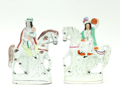 Lot 718 - A pair of Staffordshire figures, modelled as...