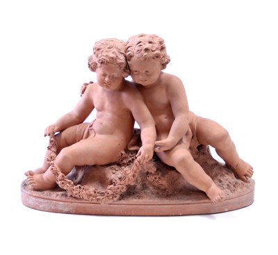 Lot 726 - A terracotta figure group depicting putti...