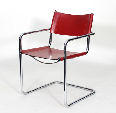 Lot 1 - A chrome cantilever frame chair with red...