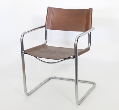 Lot 4 - A chrome cantilever frame chair with brown...