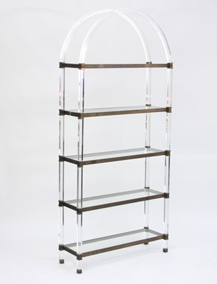 Lot 34 - A set of lucite and brass mounted shelves,...