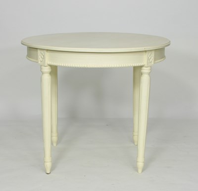 Lot 42 - A painted circular table, on fluted turned...