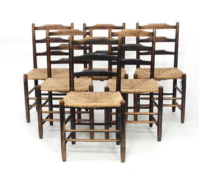 Lot 50 - A set of six ladder back chairs with rush seats